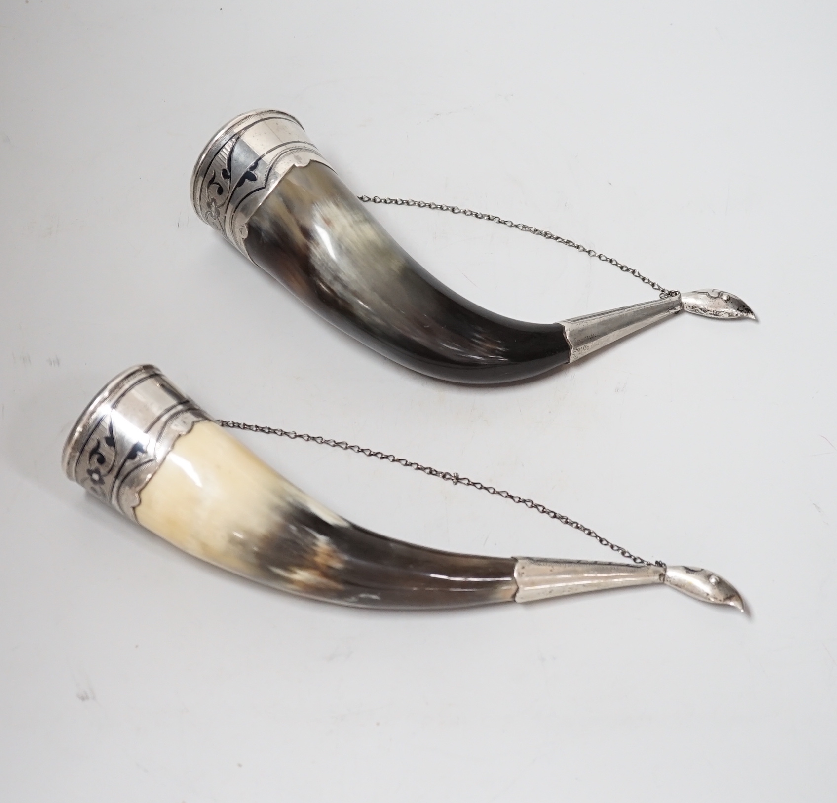 A pair of mid 20th century Soviet Union 875 white metal and niello mounted drinking horns, approx. 25cm.